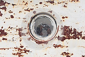 Rusty submarine armoured porthole or window metal background.