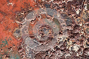 Rusty surface with many small holes - background old vintage rugged old