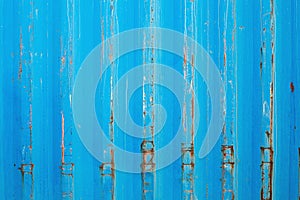 Rusty surface of metal plate with blue cracked color paint. Rust on old colored metal.