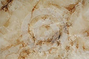 Rusty texture of light marble, imitation of Spanish natural stone. Warm abstract background