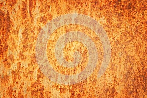 Rusty textured metal background. Cracked rusty metal wall.