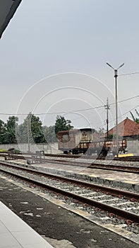 Rusty train carriages at the Cilegon train station