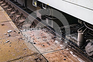 Rusty train close up at old scratched train tracks