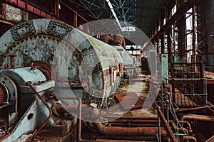 Rusty turbine generator. Abandoned destroyed by war machinery of Tkvarcheli Tquarchal power plant