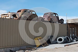 Rusty vintage automobiles on display