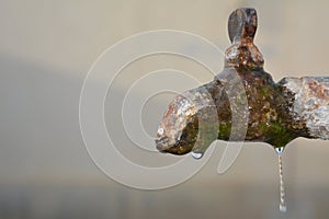 Rusty water tab with water drops