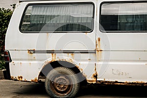 Rusty white minibus