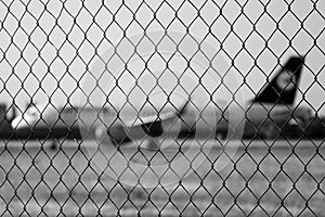 Ruzyne, Czech republic - August 16, 2018: iron fence with Lufthansa aeroplane on background in Vaclav Havel airport in Prague duri