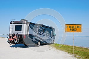 RV at beautiful beach with STRESS FREE ZONE! sign