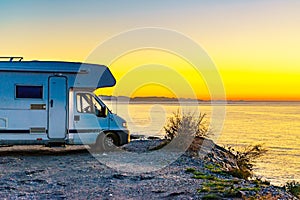Rv camper camping on sea shore, Spain
