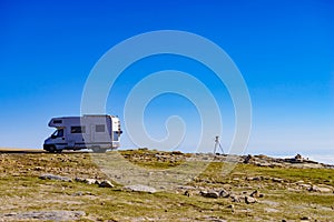 Rv camper in mountains above clouds