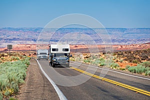 RV Camper Van on the Road. Exploring the USA. Holiday American trip. Motorhome, caravan on a road. Vehicle motor home