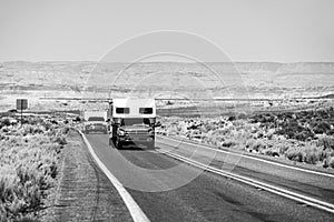 RV Camper Van on the Road. Exploring the USA. Holiday American trip. Motorhome, caravan on a road. Vehicle motor home