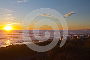 RV Campers On the Beach At Sunset