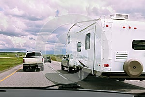 RV and cars on road photo