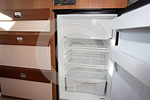 Rv open empty fridge in camper van
