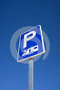 RV Recreational Vehicle Parking Sign with Blue Sky Background