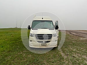 A RV Sprinter Van stuck in the mud in the Wall, SD boondocking spot in Badlands National Park