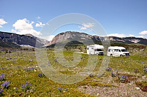 RVs cross arid wilderness