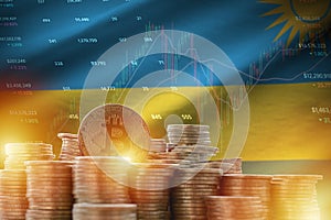 Rwanda flag and big amount of golden bitcoin coins and trading platform chart. Crypto currency photo