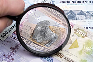 Rwandan franc in a magnifying glass