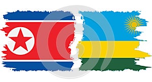 Rwandan and North Korea grunge flags connection vector