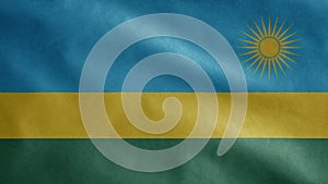 Rwandese flag waving in the wind. Close up of Rwanda banner blowing soft silk photo