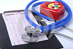 RX prescription, Red heart, asorted pils and a stethoscope on white background