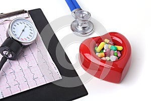 RX prescription, Red heart, asorted pils and a stethoscope on white background