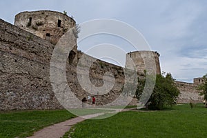 Ryabinovka Tower and Vyshka Tower with wall in medieval Izborsk fortress. Izborsk, Pskov region, Russia