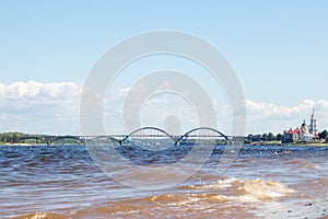 Rybinsk. View of the building of the grain exchange, the Holy Transfiguration Cathedral and the bridge over the Volga river. View