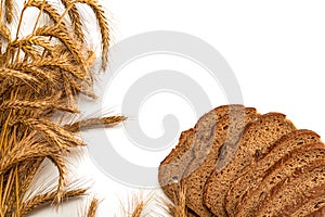 Rye bread isolated. Bakery with crusty loaves and crumbs. Fresh loaf of rustic traditional bread with wheat grain ear or spike