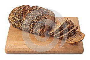 Rye bread loaf with slices on wooden cutting board