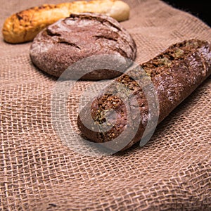 Rye bread,a loaf of white and rye bread on the table close-up,with space