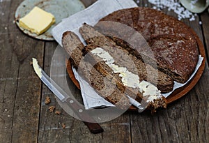 Rye bread over wooden background close-up