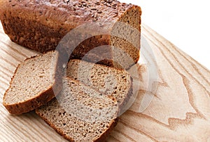 Rye bread sliced on wooden background