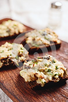 Rye bread toast with smoked mackerel, cream, cheese and green onion