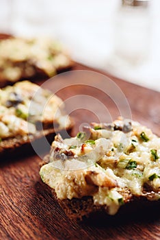 Rye bread toast with smoked mackerel, cream, cheese and green onion