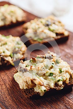 Rye bread toast with smoked mackerel, cream, cheese and green onion