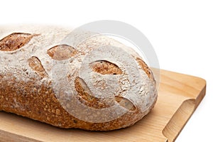 Rye bread on a wooden board on a white background