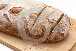Rye bread on a wooden board on a white background