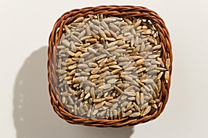 Rye cereal grain. Top view of grains in a basket. Close up.