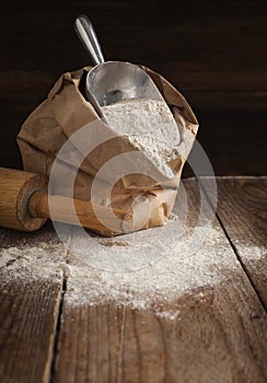 Rye flour in brown paper bag.