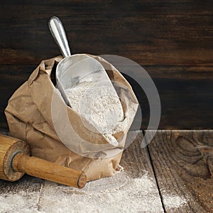 Rye flour in brown paper bag.
