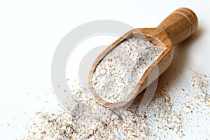 Rye flour in wooden scoop photo