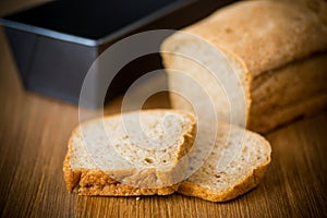 Rye homemade toaster bread in a metal form