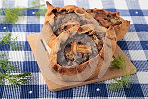 Rye pies with champignons and onions