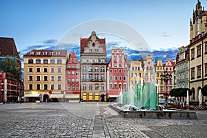 Rynek square with old colorful houses and fountain in Wroclaw,