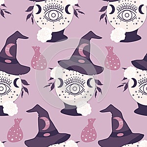 With.  rystal globe and witch hat in a seamless pattern photo