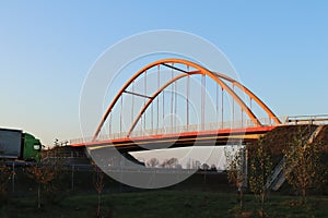 Rzeszow, Poland - 9 9 2018: Suspended road bridge across the autobahn. Metal construction technological structure. Modern